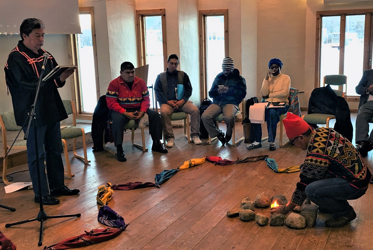 The Rev. David Wilson, left, superintendent of the United Methodist Oklahoma Indian Missionary Conference, leads a morning meditation focused on land during the gathering of indigenous peoples in Soltun, Norway. Photo courtesy of Levi Bautista.