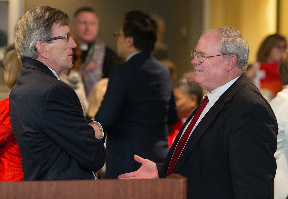 Richard A. Marsh (left) and the Rev. Keith Boyette visit one another after making oral arguments about whether a gay pastor can serve as a bishop in The United Methodist Church before the United Methodist Judicial Council, meeting in Newark, N.J., on April 25, 2017. The two argued opposite sides of the issue. 