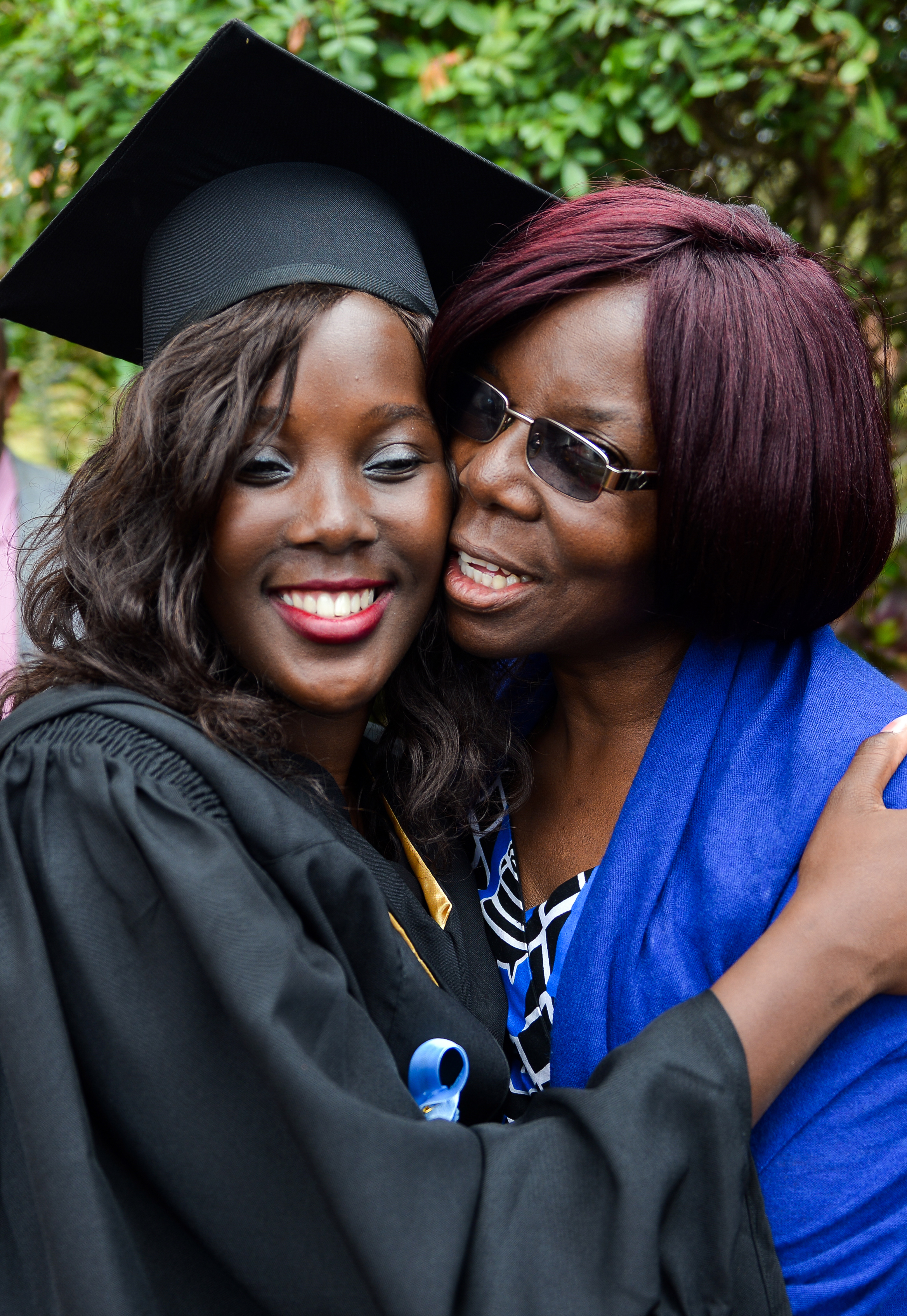 Nyasha Lynette Muropa (left) receives a hug from her mother during the 2017 commencement ceremonies at Africa University, a United Methodist school in Mutare, Zimbabwe. Muropa received a Bachelor of Accounting degree. Photo courtesy of Africa University.