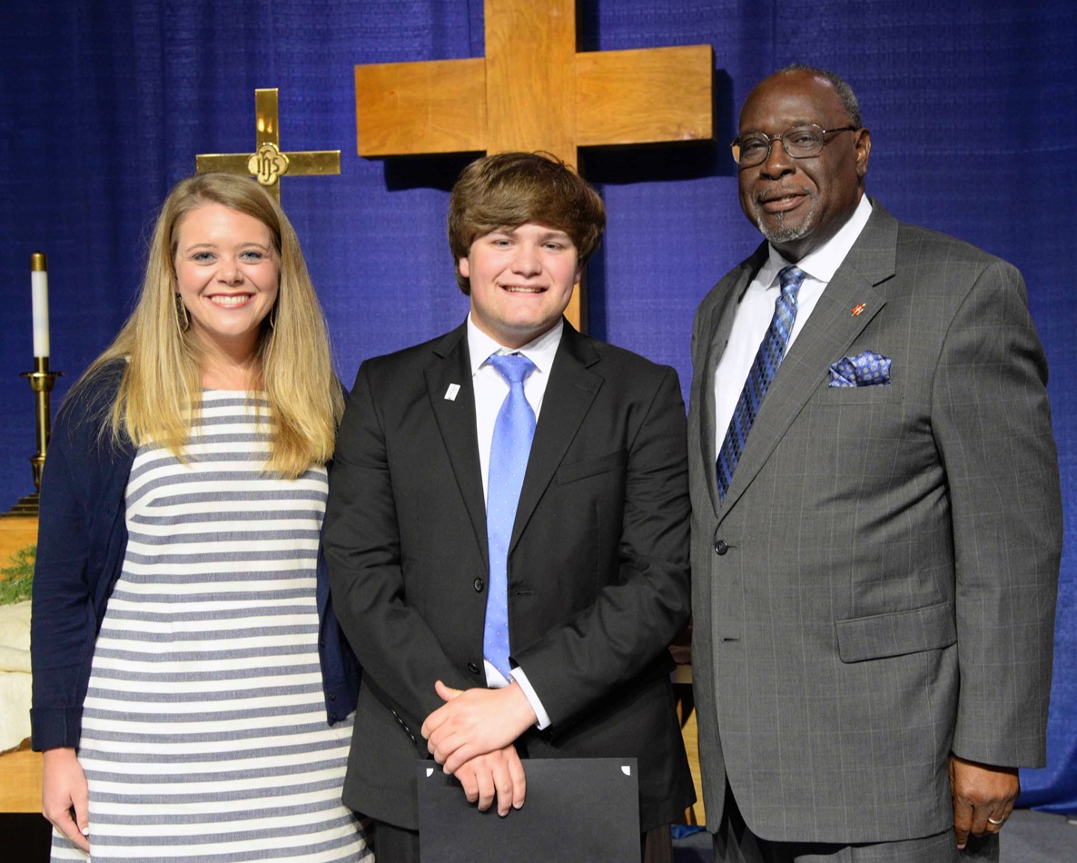 From left, Lauren Sledge, Ethan Oltremari and Bishop James Swanson Sr. stand together after Oltremari received the Mississippi Conference’s Harry Denman Evangelism Award for youth. Sledge nominated Oltremari for the award for his founding of Revival on the River and his work with youth. Photo by Amanda Jefcoat. 