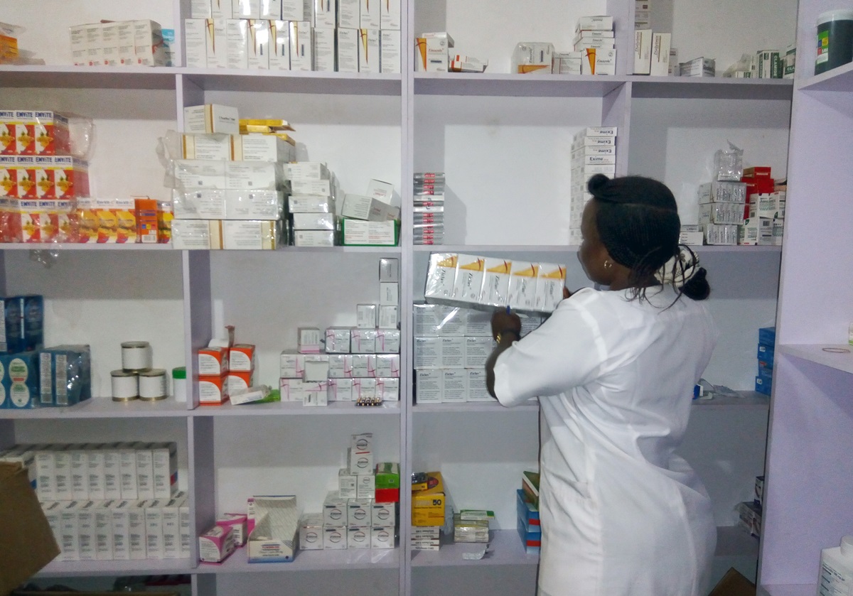 Pharmacist Dickens Ayuba picks up a carton of medicines at United Methodist Nigeria General Hospital in Jalingo, Nigeria.  Photo by the Rev. Ande I. Emmanuel, UMNS.