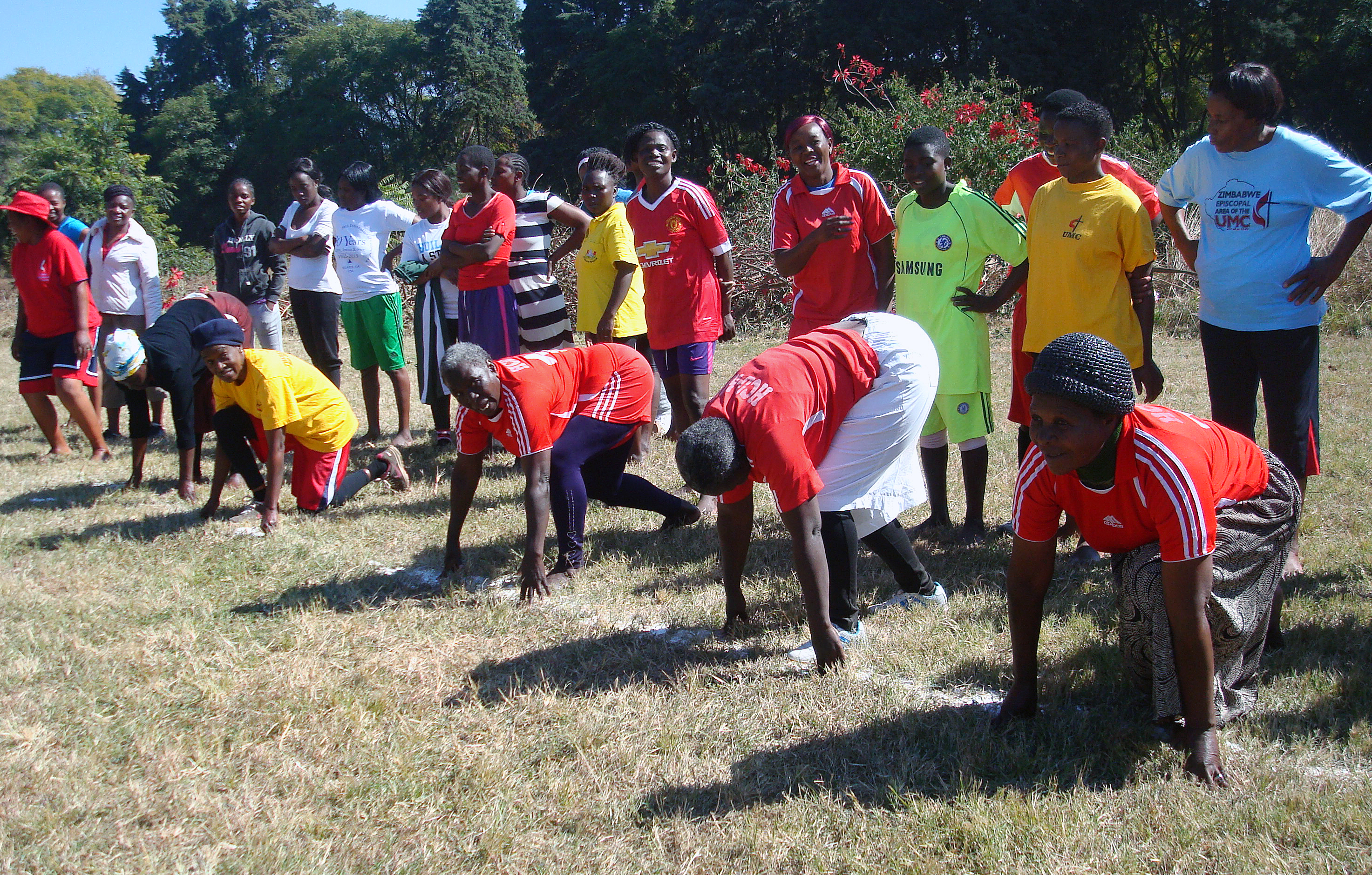 Women in the over 60s division line up for a race at a sports gala at Selborne Routledge Primary School in Harare, sponsored by the Zimbabwe Episcopal Area women’s organization, RukwadzanoRweWadzimai, to promote exercise for health. Tendai Gurupira, vice president of RukwadzanoRweWadzimai, said exercising is a cheaper and safer alternative to pharmaceutical medicine. Photo by Kudzai Chingwe, UMNS.
