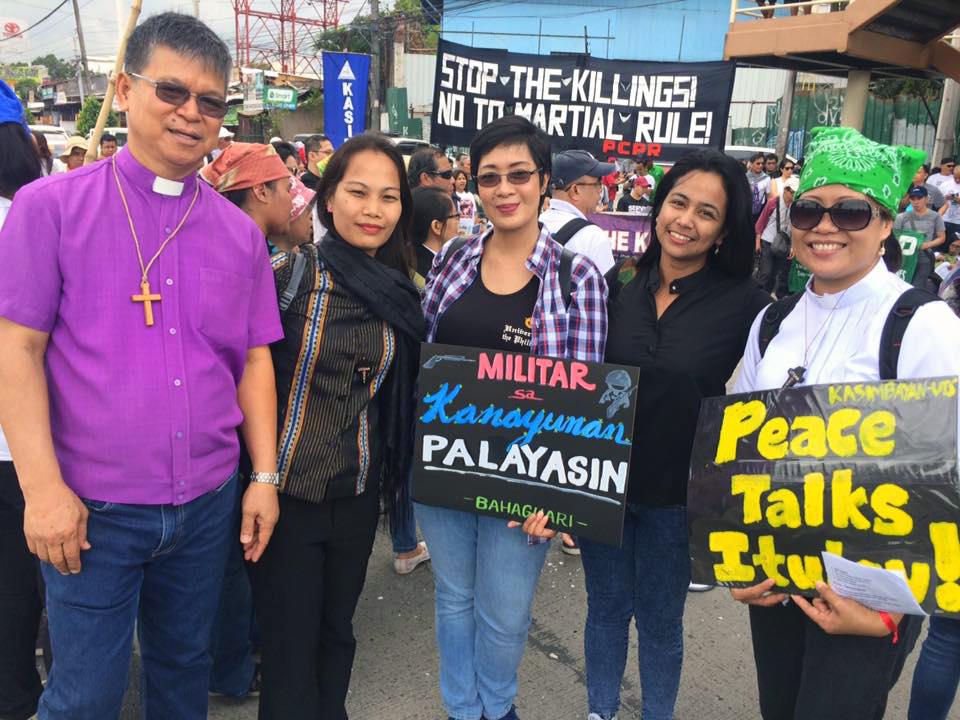 Manila Area Bishop Ciriaco Francisco (far left) and the Rev. Lizette Tapia-Raquel (center) were among those attending a demonstration on the day of Philippines President Rodrigo Duterte’s State of the Nation address on July 24 in Manila. United Methodists have joined in demonstrations and calls for an end to martial law in Mindanao. Photo courtesy of Lizette Tapia-Raquel.