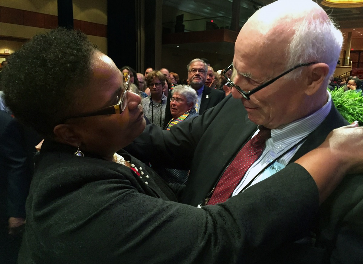 The Rev. J. Phil Wogaman (right) and Bishop LaTrelle Miller Easterling greet each other during the 233rd session of the Baltimore-Washington Conference in Washington, D.C. Wogaman handed in his clergy credentials during the clergy session over the case of T.C. Morrow, a lesbian who was not approved for ordination as a deacon in 2016 or 2017 and for others he feels have been excluded. Photo by Dawn M. Hand, Foundry United Methodist Church.