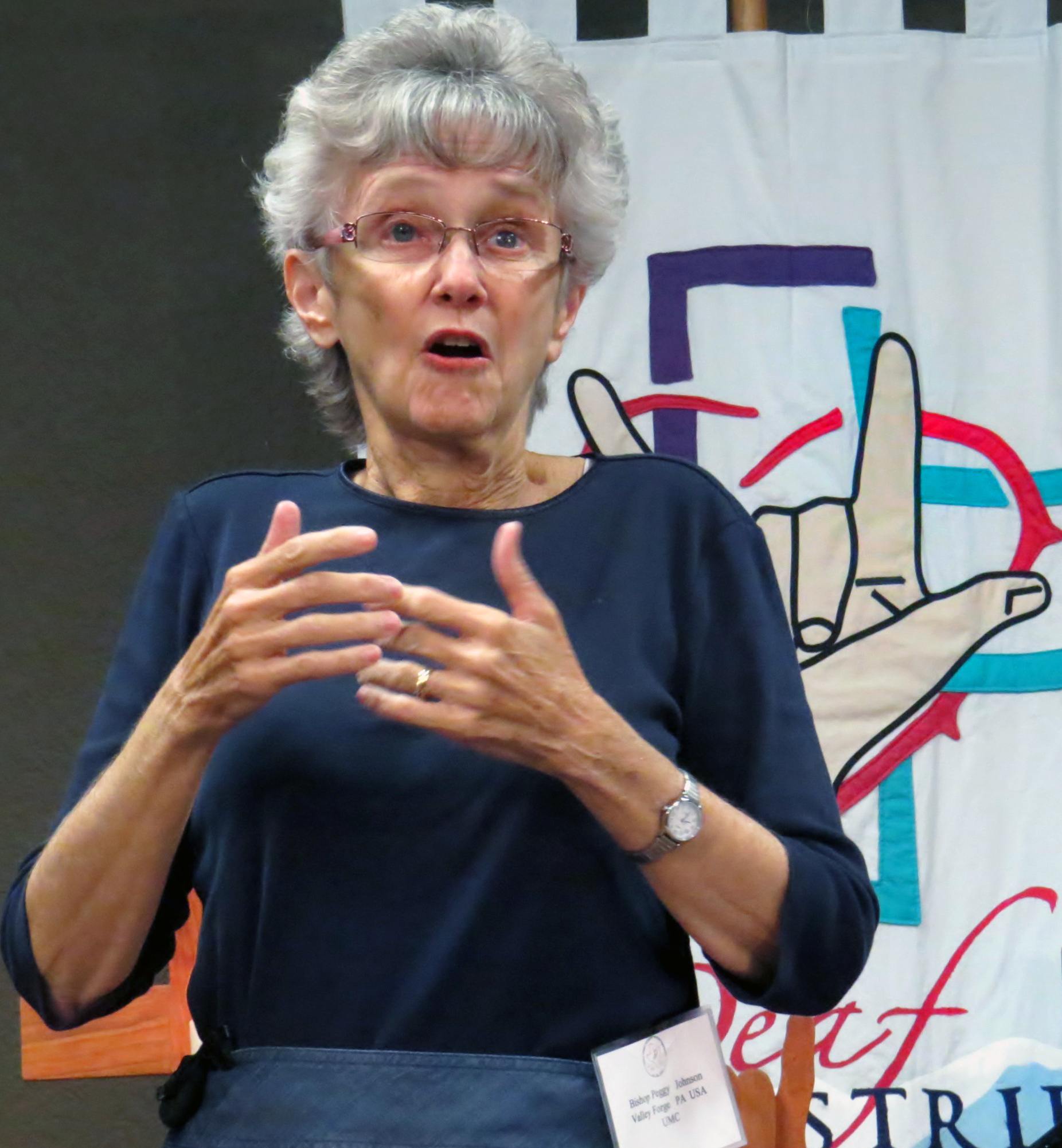 Philadelphia Area Bishop Peggy Johnson uses sign language in delivering her sermon for the Aug. 1, 2017, opening worship service at the Global Methodist Missions Conference of the Deaf in Waxahachie, Texas. Photo by Sam Hodges, UMNS.