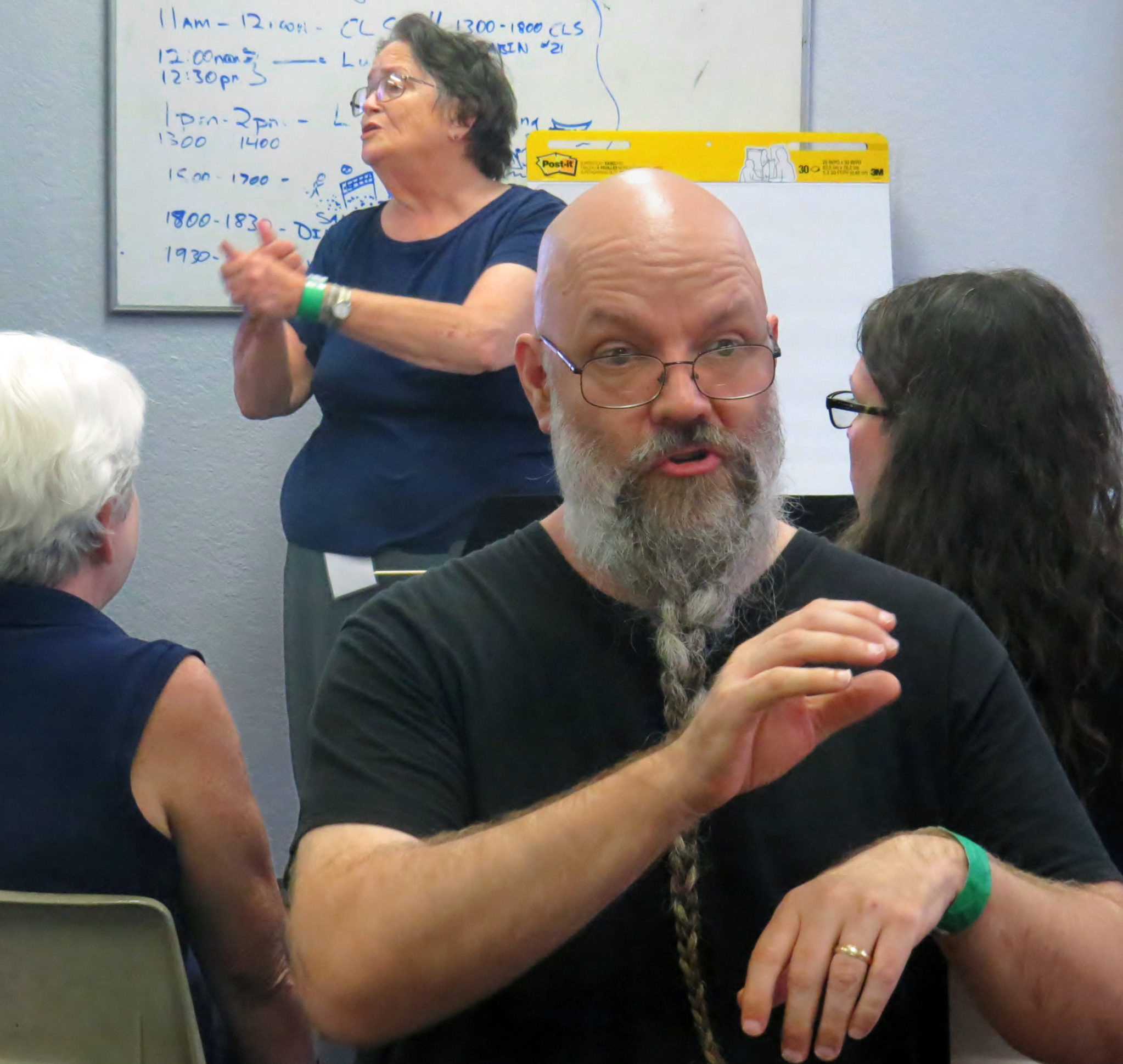 Jason Hopkins interprets using Ghanan sign language while behind him Carol Stevens leads a certified lay servant ministry class in American Sign Language. The class is offered as part of the Global Methodist Missions Conference of the Deaf in Waxahachie, Texas. It’s the United Methodist Church’s first certified lay servant tailed to meet the needs of Deaf people. Photo by Sam Hodges, UMNS.