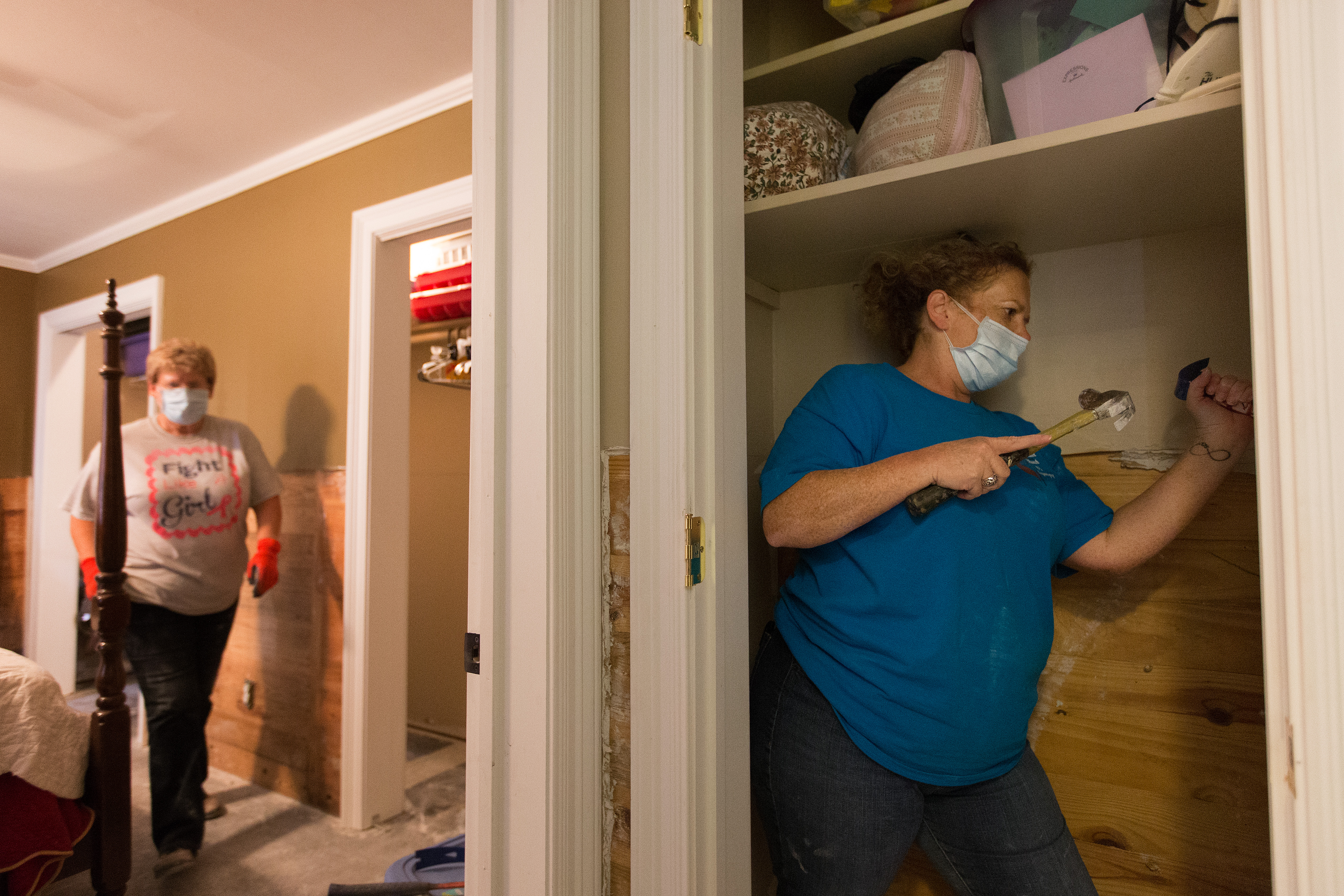 Volunteers Lesa Parmer (right) and Kathleen Stoll of First United Methodist Church in Logansport, La., remove flood-damaged drywall at a home in Crowley, La., in August 2016. The Louisiana Conference’s flood recovery ministry is asking for continued volunteer response to continue the work. File photo by Mike DuBose, UMNS.