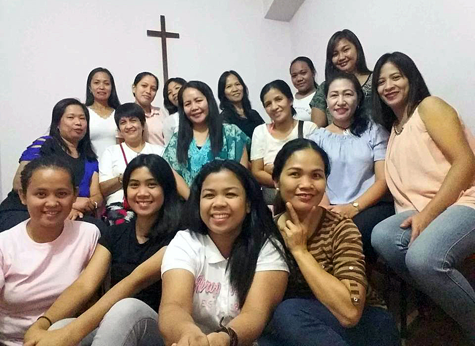 Susan E. Dillozon, (center in green) is a United Methodist deaconess who is serving as a pastoral worker in Methodist Filipino Ministry in Macau, China. The mission house became a refuge to evacuees after the devastation of Typhoon Hato, the biggest storm in this area in years. Photo courtesy of Susan Dillozon.