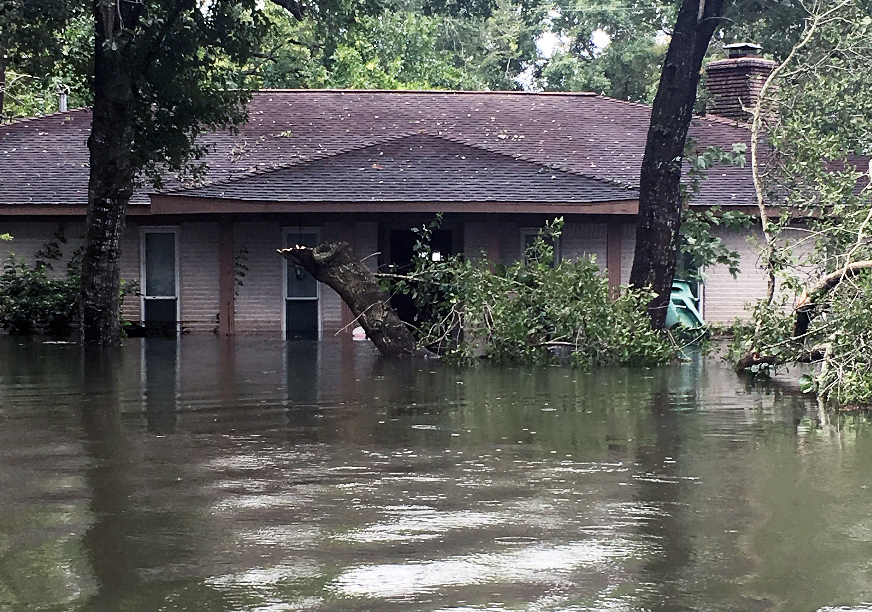 Floodwaters from Tropical Storm Harvey engulf the home of the Rev. Andrew Wolfe, associate pastor at St. Paul’s United Methodist Church in Houston. Photo courtesy of the Rev. Andrew Wolfe.