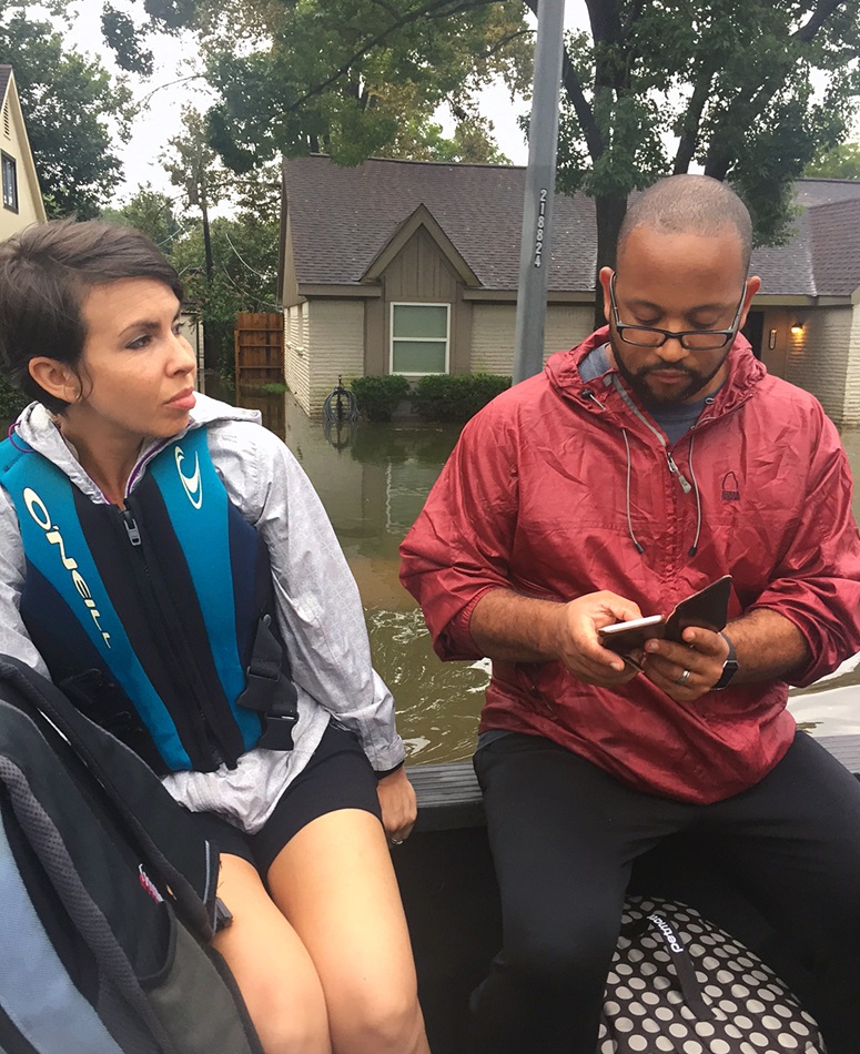 The Rev. R. DeAndre Johnson and his wife, Kelsey, get evacuated by boat on Aug. 27, after their Houston area home took on nearly a foot of water. A team from Christ United Methodist Church in Sugar Land, where Johnson is on staff, got the Johnson family to safety. Photo courtesy the Rev. Chapell Temple. 