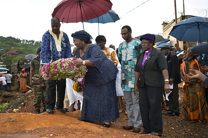 Sierra Leone’s First Lady, Sia Nyama Koroma, lays the first wreath at the site of the landslide after a worship service held in memory of the dead those who died in the landslide and flooding two weeks ago. Many of the bodies were never recovered. Photo by Phileas Jusu, UMNS.