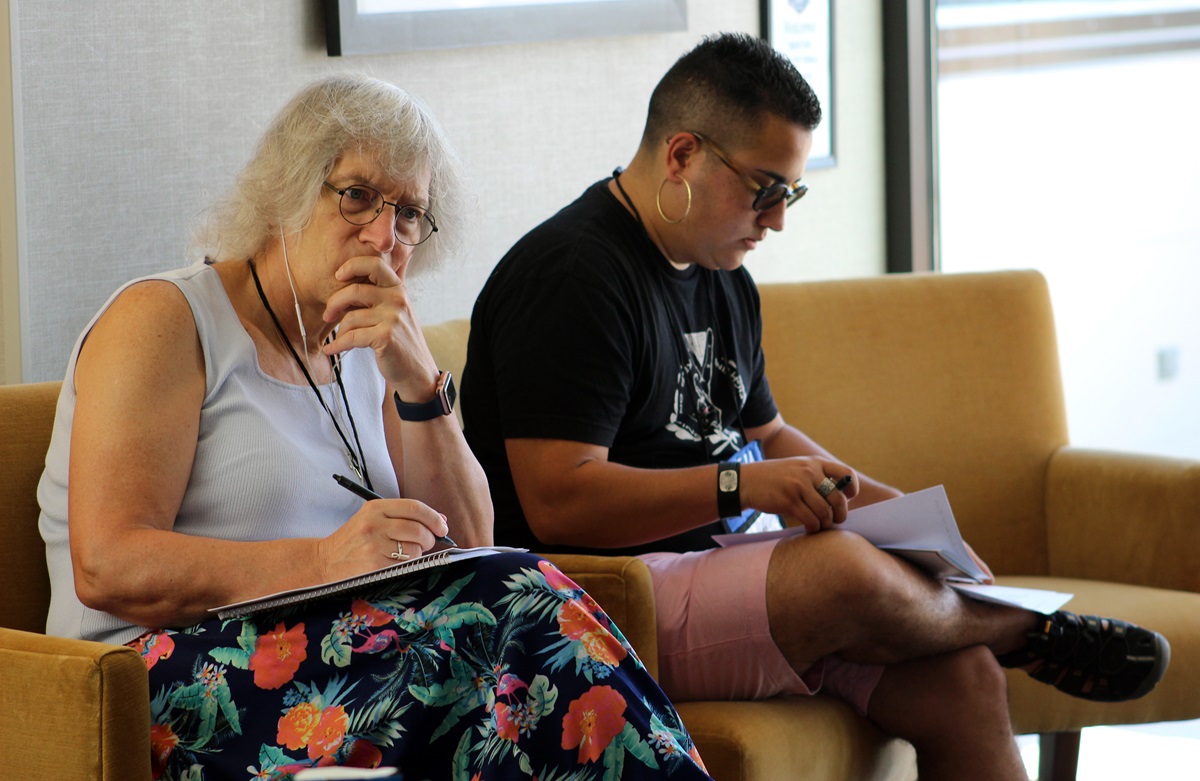 Alyss Swanson and RJ Robles write liturgy for a communally planned closing worship for Rooted, an ecumenical trans and gender-expanded retreat held in Chicago Aug. 11-13.
