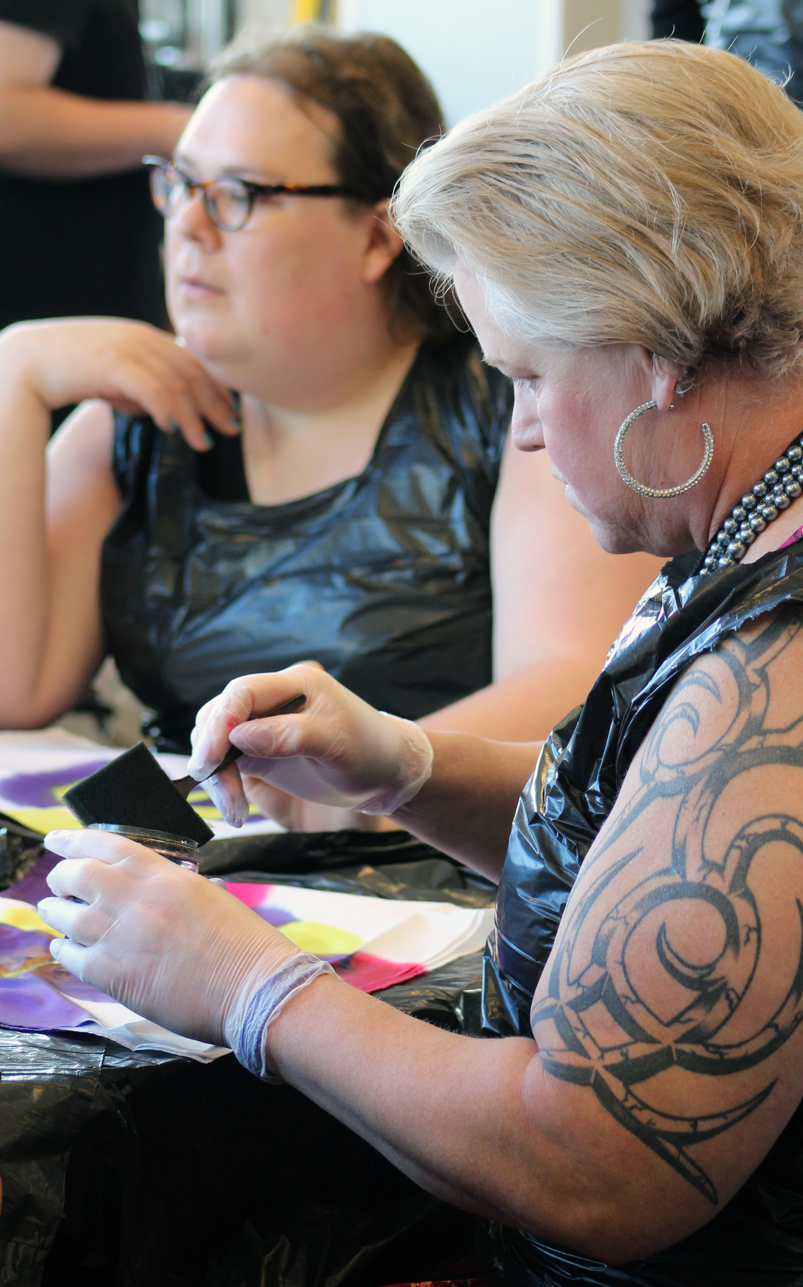 Sasha Strock engages in an art station led by Grace Cox-Johnson during Rooted, an ecumenical trans and gender-expanded retreat held in Chicago Aug. 11-13.