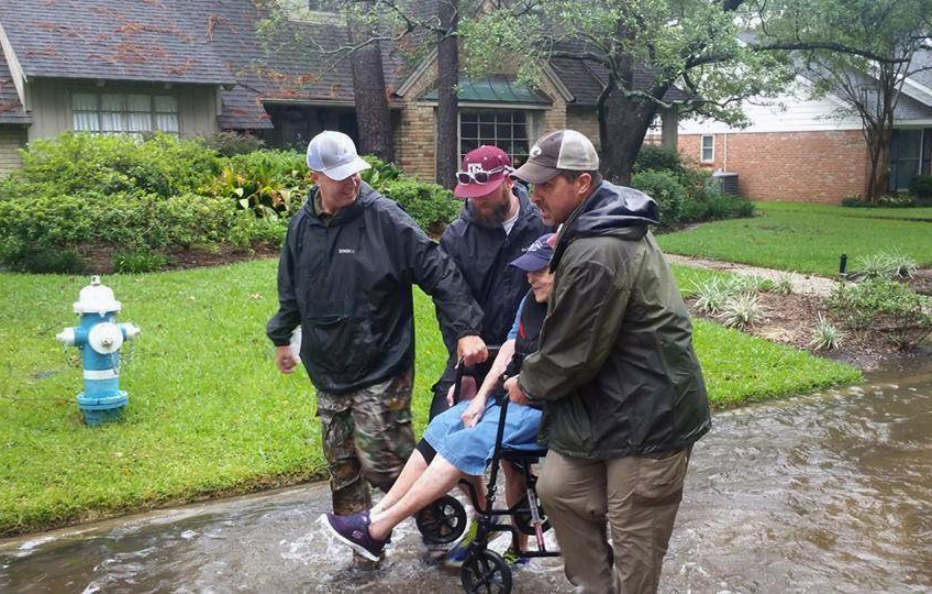 The Rev. John Stephens, senior pastor of Chapelwood United Methodist Church in Houston, (left) and the Rev. Josef Klam, directing pastor of Adult Discipleship at Chapelwood, (right), assist with a rescue during Hurricane Harvey. Photo courtesy of Chapelwood United Methodist Church.