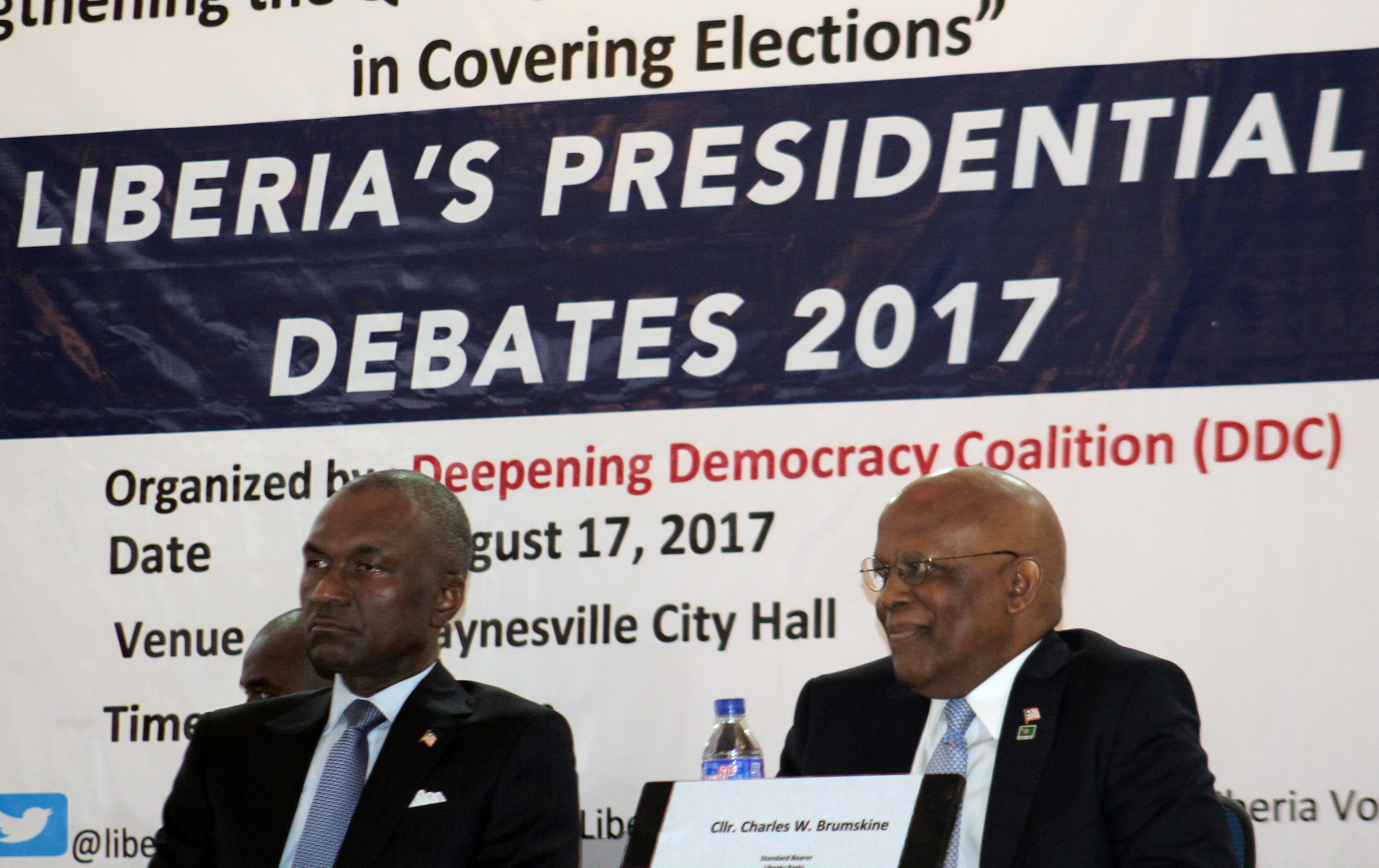 Alexander B. Cummings (left), a 2017 presidential candidate in Liberia, and Charles Brumskine, a Liberian politician and attorney, listen during the presidential debate in Paynesville City, Liberia. The Civil Society and Trade Union Institutions of Liberia, now headed by United Methodist Church leadership, says it will not endorse presidential candidates whose platforms do not consider Liberia’s labor force. Photo by Julu Swen, UMNS.