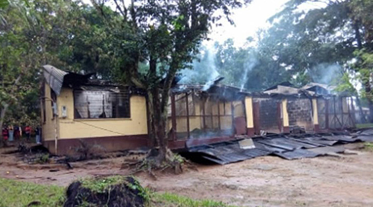 The residence where Dr. Shane Sam Mathew lived at Ganta United Methodist Mission in Liberia lies in ruins after a fire that killed the visiting dentist and nursing instructor from India. Photo by Julu Swen, UMNS.