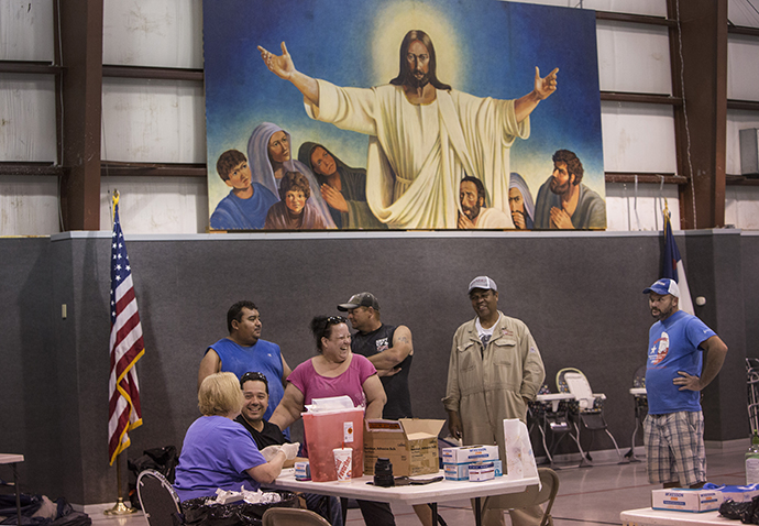 Nurse Ruth Hanson from Winnie, Texas gives tetanus shots inside the gym at First United Methodist Church in Vidor, Texas. Photo by Kathleen Barry, UMNS.