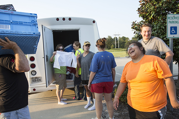 The work crew from First United Methodist Church in Carthage, Tenn. rejoices at the end of a day mucking out homes damaged by flooding from Hurricane Harvey. In Orange, Texas. Photo by Kathleen Barry, UMNS.