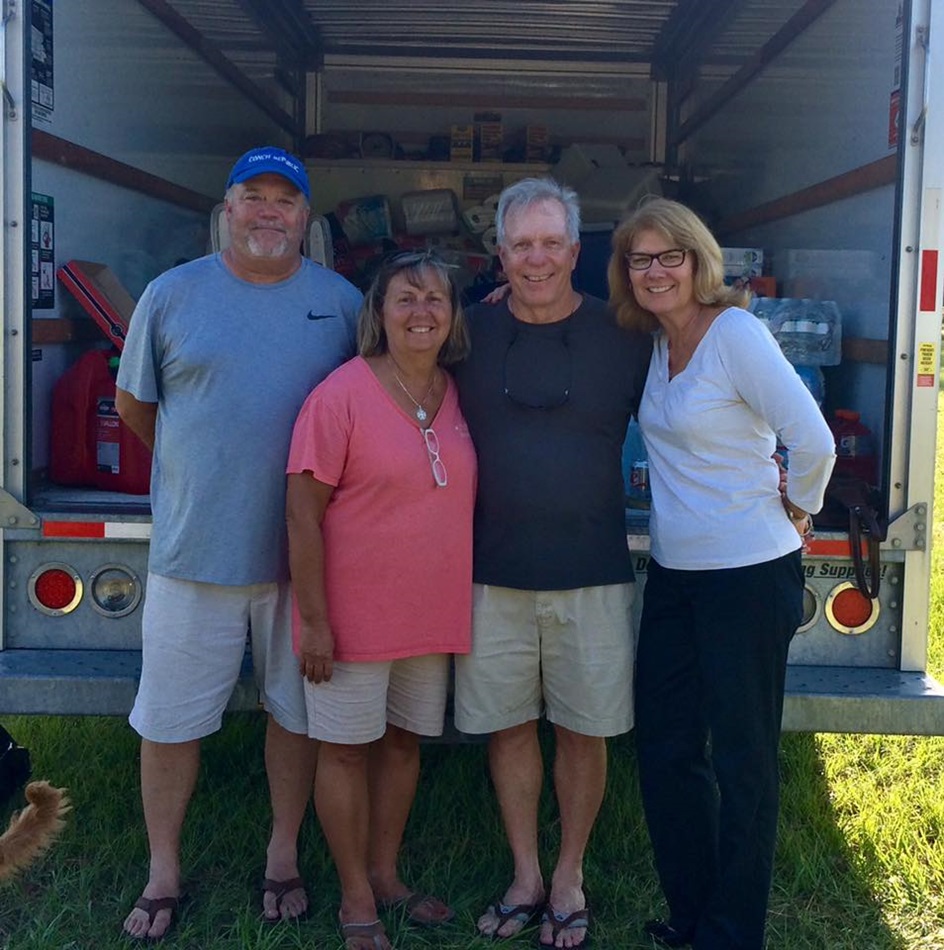 United Methodist clergy stand with a truck they are filling with relief supplies for people in Big Pine Key and Key West, Fla., who were affected by Hurricane Irma. From left are: the Revs. John Hill of Big Pine Key United Methodist Church, Terri Hill of Key West United Methodist Church, Gary Spencer, superintendent of Atlantic Central District and Annette Stiles Pendergrass of Suntree United Methodist Church in Melbourne, Fla., where the supplies are being collected. 