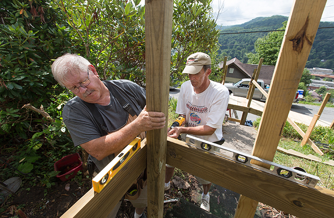 Wayne Davis (left) and the Rev. Russell Lee work to restore access to a home in Richwood, W. Va., that was damaged by runoff from a June 2016 flood. Davis is from Byrd Chapel United Methodist Church in Kents Store, Va., and Lee is pastor of First Presbyterian Church in South Boston, Va. Photo by Mike DuBose, UMNS.
