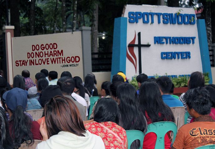 More than 100 United Methodists and Roman Catholics gathered Sept. 21 during the Dawn Prayer for Peace, led by Davao area United Methodist Bishop Rodolfo Juan in front of the Spottswood Methodist Center in Kidapawan City, North Cotabato, Philippines. Photo courtesy of Remy Lozano.