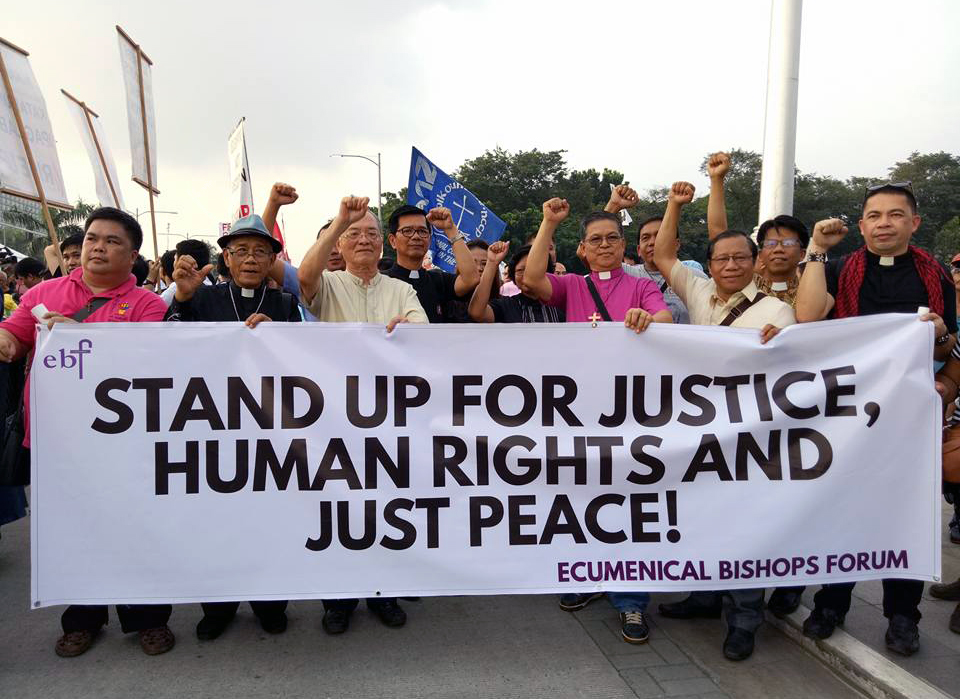 Members of the Ecumenical Bishops Forum gathered with the thousands of protesters in Rizal Park, Manila, on Sept. 21, marking the 45th year of martial law in the Philippines. It was also called a "National Day of Protest."  Among the bishops were, second from left, retired United Methodist Bishop Solito K.Toquero and, fifth from left, Manila area Bishop Ciriaco Q. Francisco. Photo courtesy of Ofelia A. Cantor.