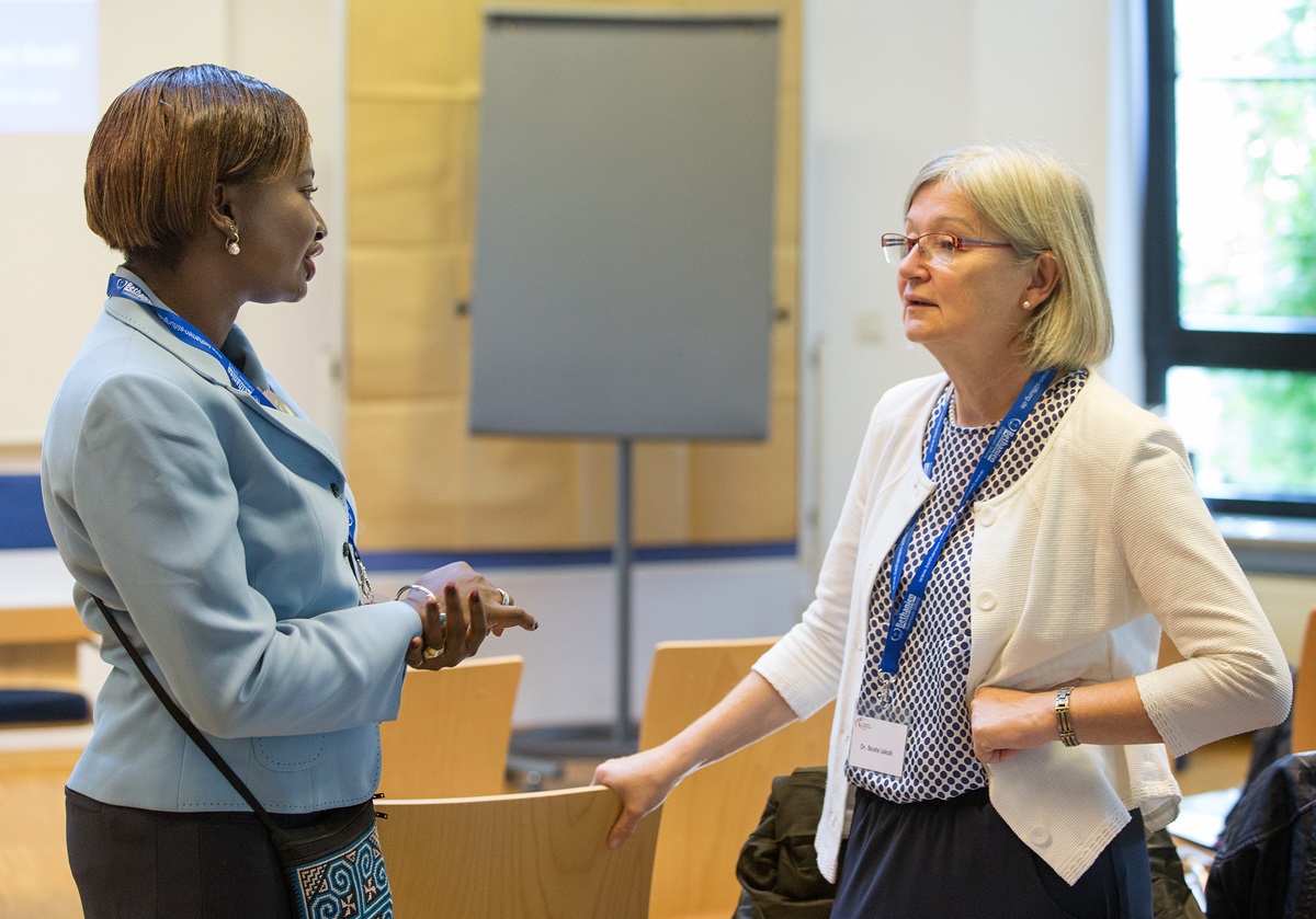 Dr. Olusimbo Ige (left) visits with Dr. Beate Jakob during the International Health Forum of The United Methodist Church in Stuttgart, Germany. Ige is director of global health for the United Methodist Board of Global Ministries and Jakob works with the German Institute for Medical Mission. Photo by Mike DuBose, UMNS.