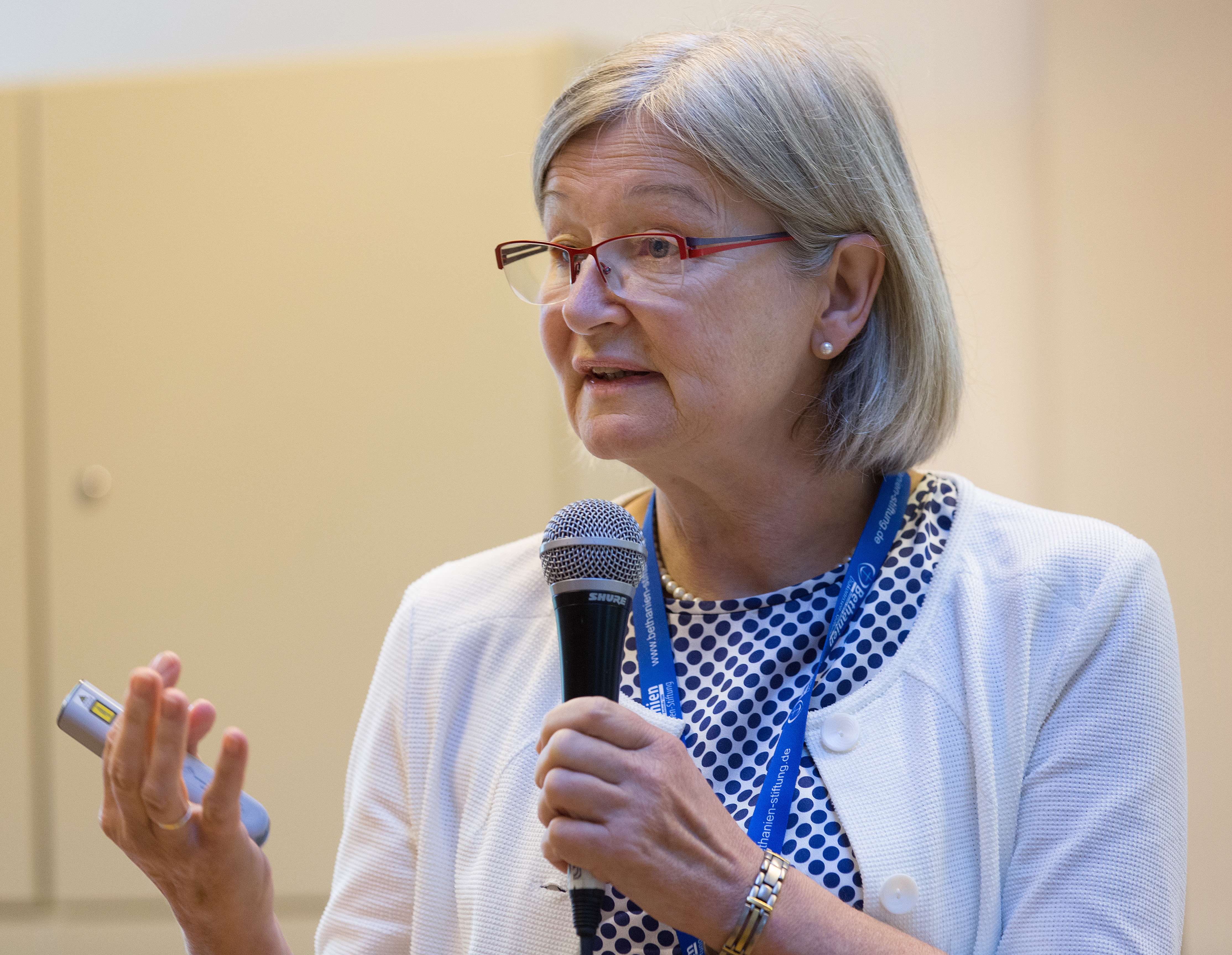 Dr. Beate Jakob addresses the International Health Forum of The United Methodist Church in Stuttgart, Germany. Jakob said the need for churches to play a role in health care was apparent during the Ebola outbreak that began in 2014 in Africa. Photo by Mike DuBose, UMNS. 