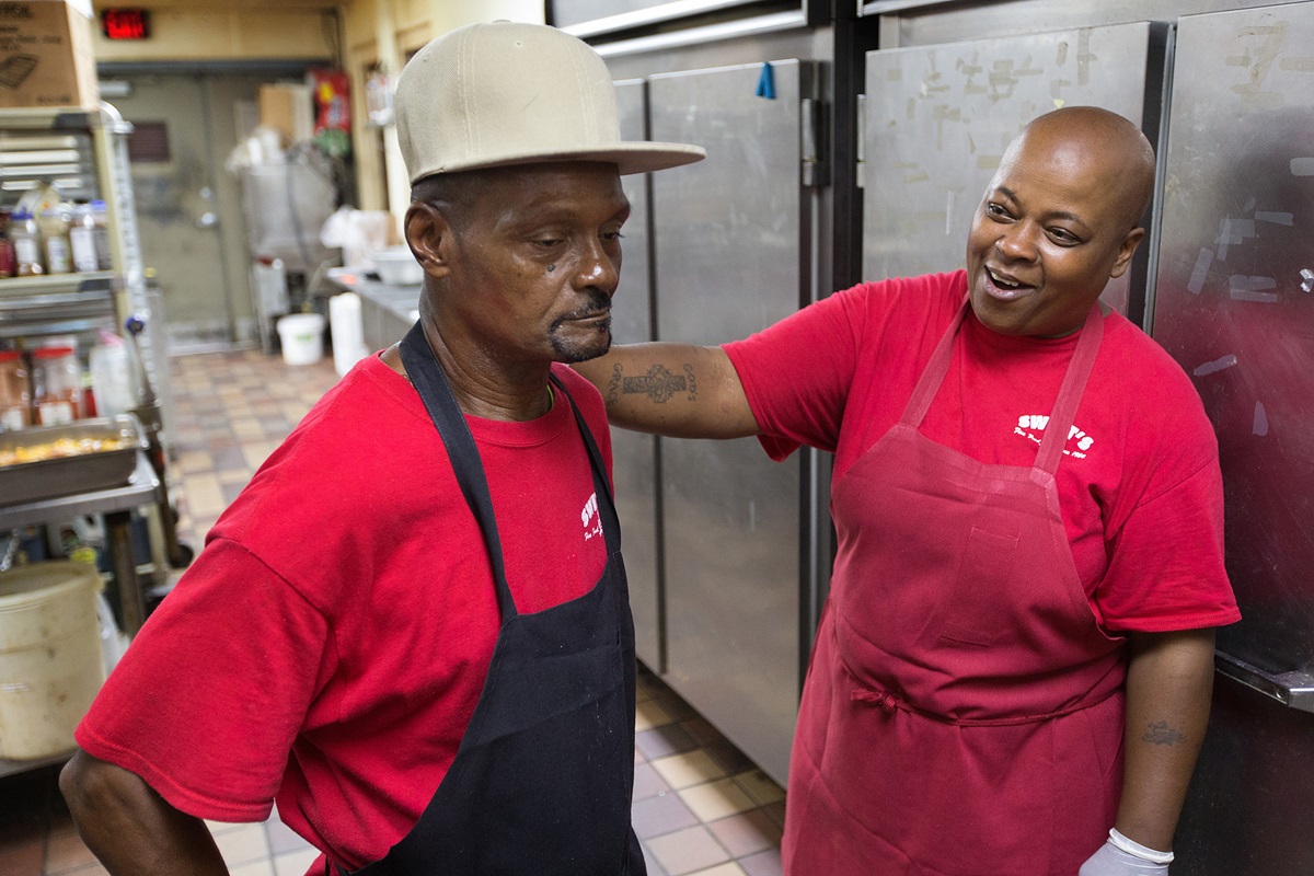 Debra Kelley, right, enjoys a moment with Johnny Woods during their morning shift at Swett’s, a Nashville southern home-style restaurant. Both Kelley and Woods are ex-offenders. “Mr. Swett believes in second chances,” Kelley says. Photo by Mike DuBose, UMNS.