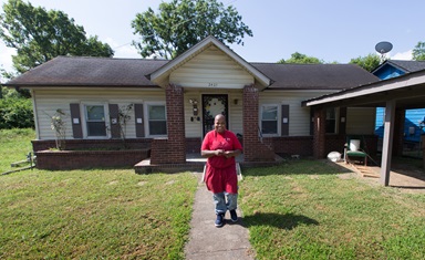 Debra Kelley walks out of her house preparing to go to work. She says having a key to her own front door is a precious gift. Photo by Mike DuBose, UMNS. Debra Kelley walks out of her house preparing to go to work. She says having a key to her own front door is a precious gift. Photo by Mike DuBose, UMNS.