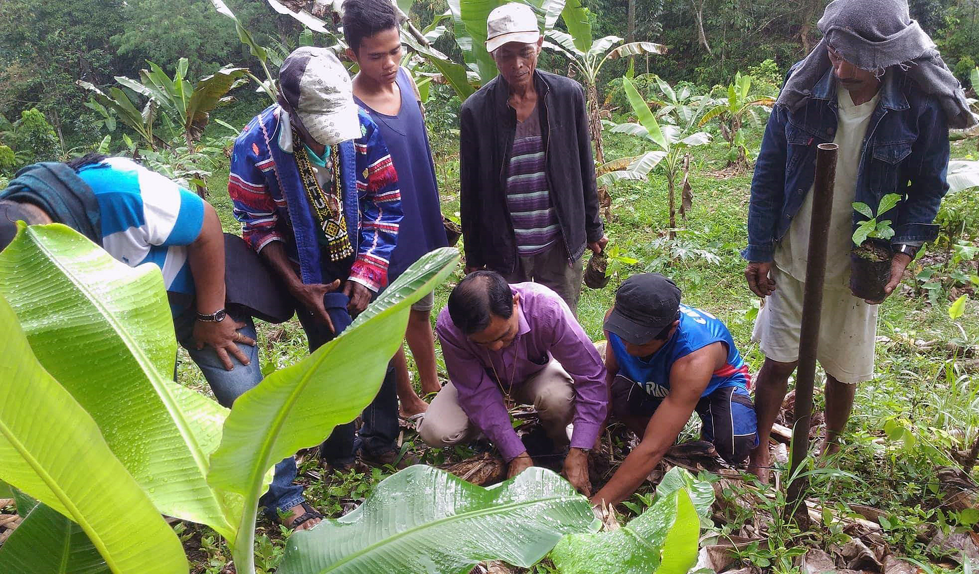 Bishop Rodolfo A. Juan (center in lavender  shirt) helps plant a sapling with members of Hope Valley United Methodist Church during a DEA-wide tree planting event. Photo courtesy Bishop Rodolfo A. Juan.