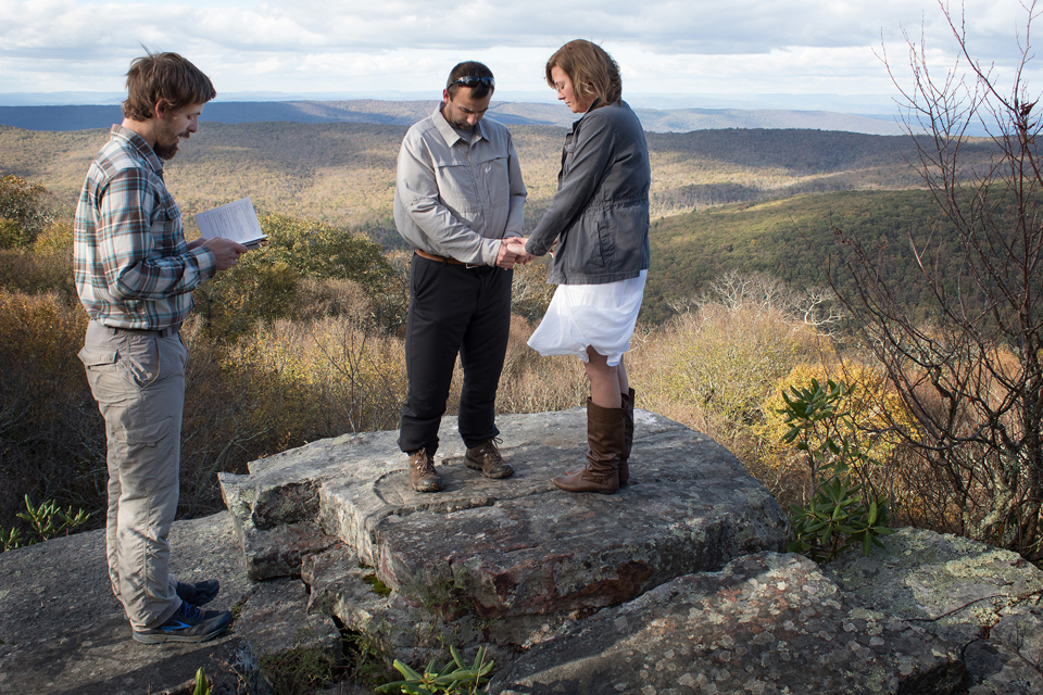 The Rev. Matt Hall conducts a renewal of wedding vows service for Nick and Stephanie Houle atop Sugar Run Mountain, just off the Appalachian Trail near Pearisburg, Va. Hall serves as a United Methodist chaplain appointed to the trail community.