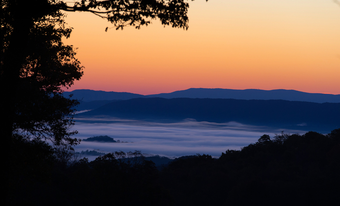 The sun rises over the fog-shrouded Shenandoah Valley just off the Appalachian Trail near Pearisburg, Va.