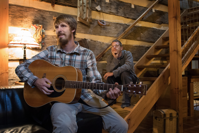 The Rev. Matt Hall plays guitar at the Woods Hole Hostel, a popular rest stop for hikers just off the Appalachian Trail near Pearisburg, Va.