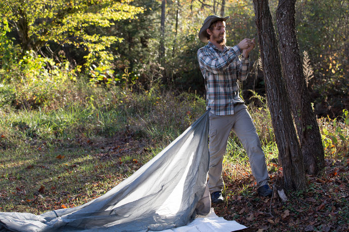 The Rev. Matt Hall puts up a tarp for shelter in the campground behind Trent's Grocery, just off the Appalachian Trail in Bland County, Va. 