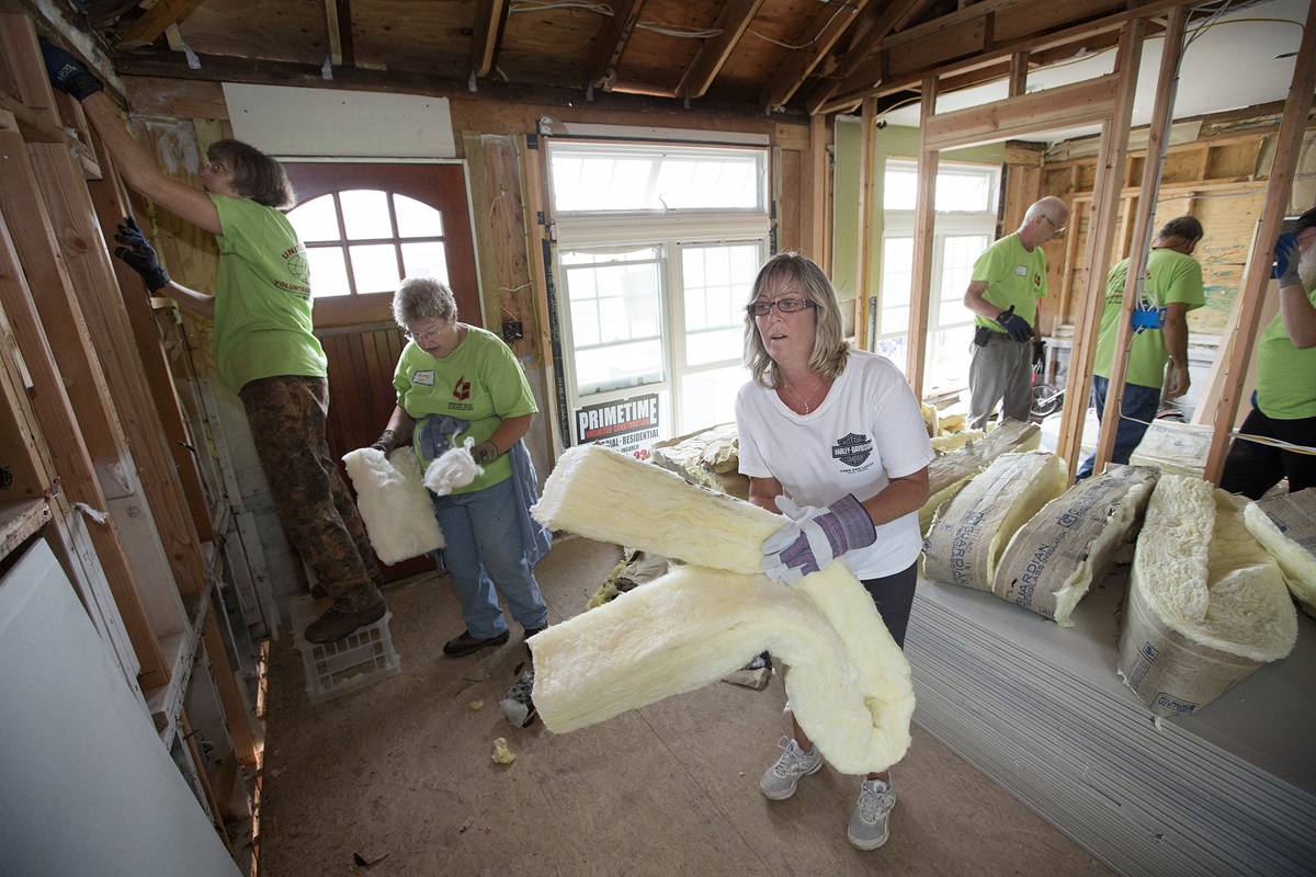 Lisa Mentges (center) works with a United Methodist volunteer team in October 2013 to repair her home in Long Beach, N.Y. after it was flooded by Hurricane Sandy. The volunteers are from the California-Pacific Conference. United Methodists have continued to help with recovery in the five years following the storm. File photo by Mike DuBose, UMNS.