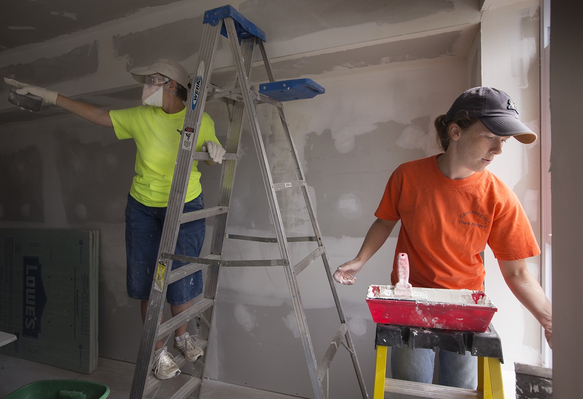 Volunteers Kayt Hughes (right) and Janice Bosley of Stewartstown (Pa.) United Methodist Church finish drywall in October 2013 at a home in Atlantic City, N.J., that was damaged by Hurricane Sandy. They were part of a team from the volunteer ministry Servants, Inc., and working through A Future With Hope, which has led long-term recovery efforts for the Greater New Jersey Conference over the past five years. File photo by Mike DuBose, UMNS.