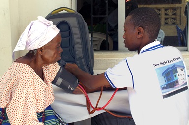 A staff member of the New Sight Eye Center in Liberia checks vitals on one of the senior citizens who benefited from free clinical health services provided by The United Methodist Church’s Aging Ministry. The clinic was part of the activities for Senior Citizens Sunday sponsored by the Liberia Conference, and benefitted hundreds of seniors. Photo by Julu Swen, UMNS. A staff member of the New Sight Eye Center in Liberia checks vitals on one of the senior citizens who benefited from free clinical health services provided by The United Methodist Church’s Aging Ministry. The clinic was part of the activities for Senior Citizens Sunday sponsored by the Liberia Conference, and benefitted hundreds of seniors. Photo by Julu Swen, UMNS.