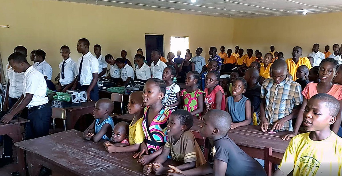 Children sing during a celebration marking the gift of solar power, funded by the United Methodist Church in Norway, to the Bishop Judith Craig Children Village in Liberia. 