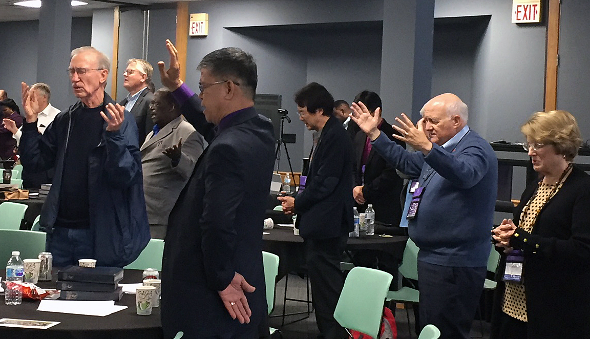 Bishops pray for the Holy Spirit’s guidance during worship Nov. 8 at the Council of Bishops meeting at Lake Junaluska, N.C. Photo by Heather Hahn, UMNS.