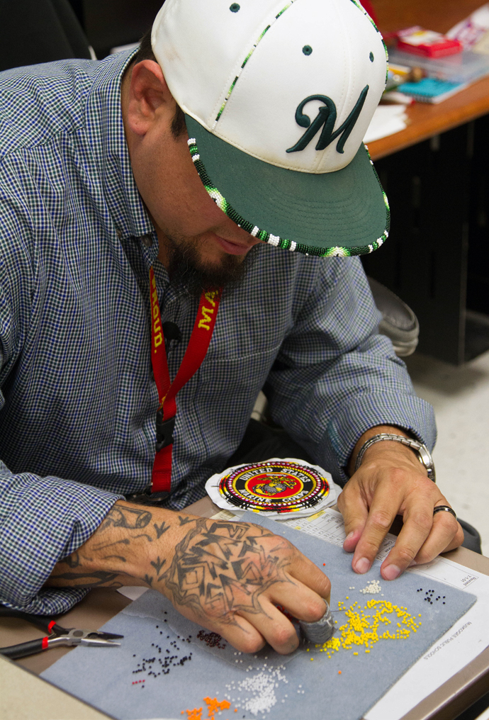 To help the students at Rougher Alternative Academy center their lives, “Bugsy” Barnoski teaches them how to make Native crafts such as beadwork, dream catchers and shawls. He also helps them learn tribal languages. Photo by Ginny Underwood, UMNS.