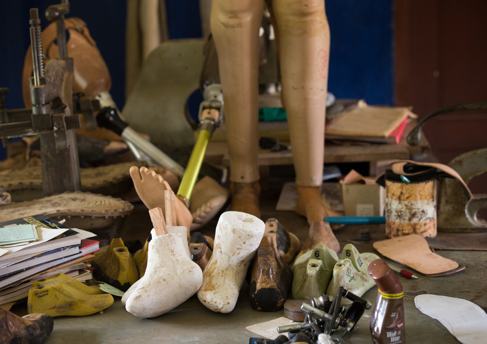 Prosthetics line a workbench at the Ganta Leprosy and TB Rehab Center. Photo by Mike DuBose, UMNS.