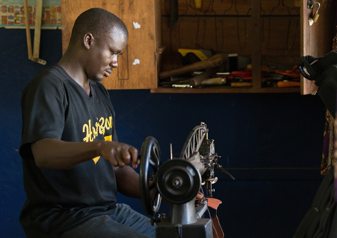 Martin Dolo makes custom shoes for patients whose feet have been affected by leprosy at the Ganta Leprosy and TB Rehab Center. Photo by Mike DuBose, UMNS.