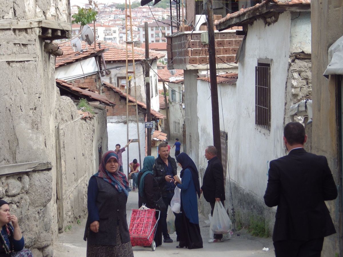 Refugees wait in the street near the Ulus Refugee Center in Ankara, Turkey. Photo by Tacy Surrett. 