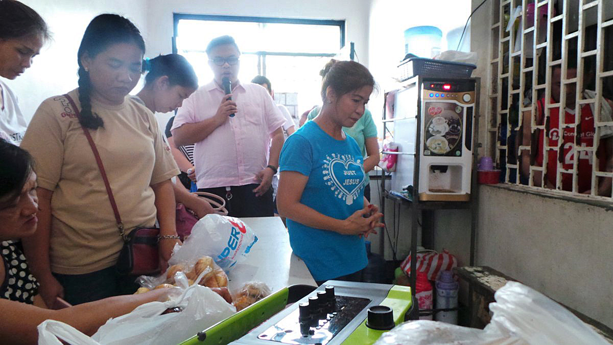 Members of New Hill Burning Bush United Methodist Church close their visit with a prayer. Pastor Jose Michael Villena, administrative pastor, said that God's faithfulness led the church to do mission and service.