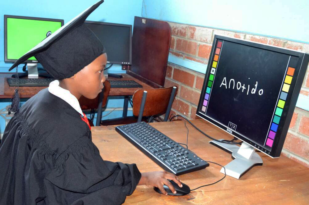 Anotida Kadiramwando writes her name on the computer at Murewa Day Care Centre in Zimbabwe. A program, sponsored by The United Methodist Church in collaboration with the Ministry of Primary and Secondary Education in Zimbabwe, aims to have computer laboratories at all United Methodist-run schools in Zimbabwe by 2025. Photo by Kudzai Chingwe, UMNS.