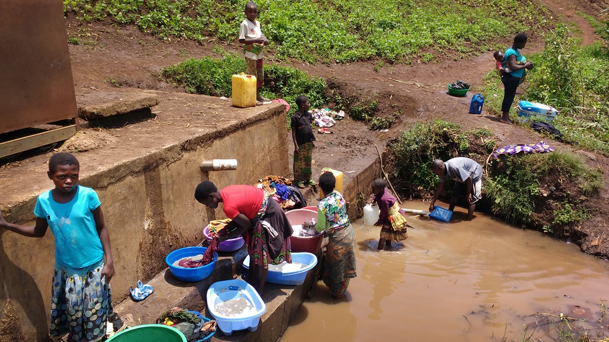 Women and children gather water at a watering point in the Irambo District of Bukavu, Democratic Republic of Congo. A cholera epidemic was declared in the South Kivu Province in August and continues today. Photo by Philippe Kituka Lolonga, UMNS