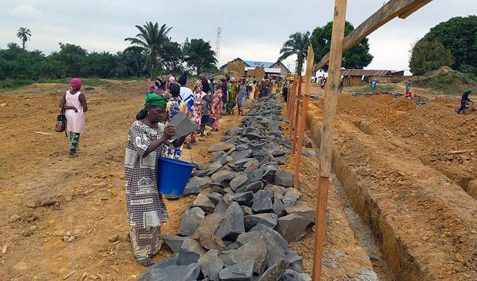 Women leaders and rape survivors join together in laying the foundation of the Mama Lynn Center in Kindu, East Congo. The center will give Congolese rape survivors a chance to heal and overcome the crippling stigma that makes them outcasts. Photo by Judith Osongo Yanga, UMNS.