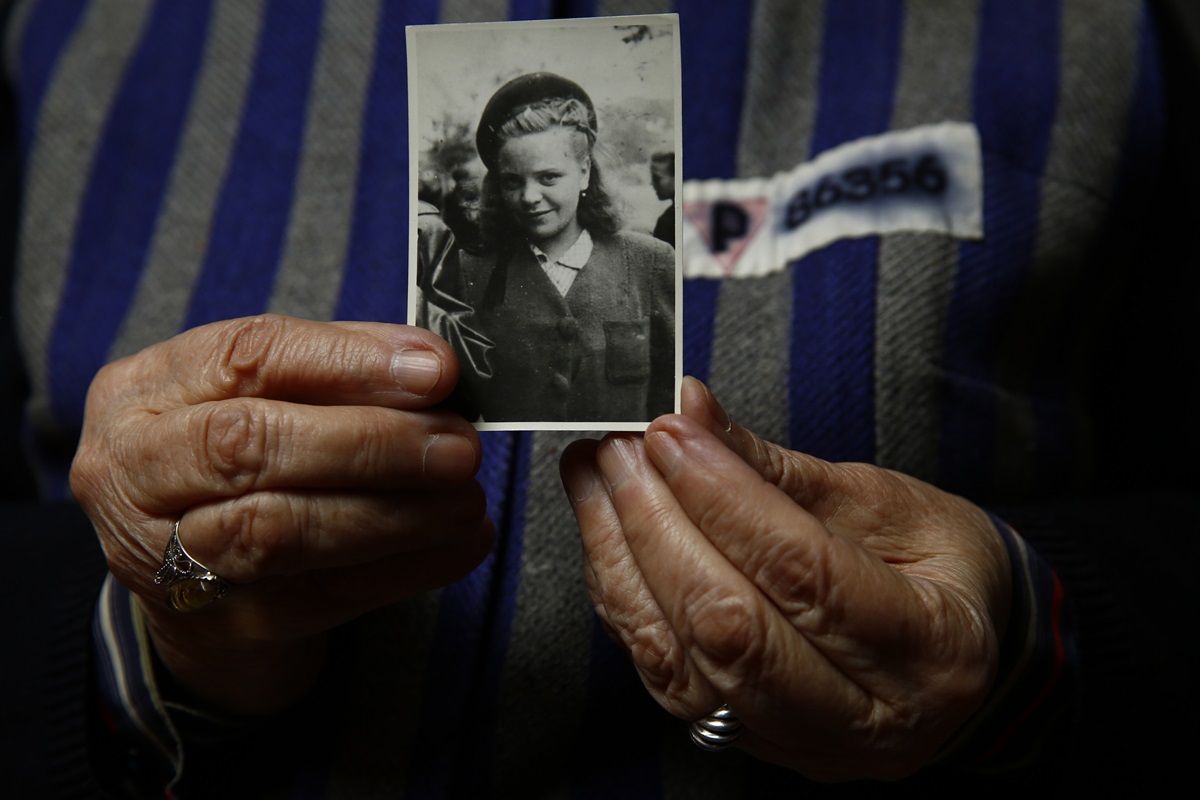 Auschwitz death camp survivor Jadwiga Bogucka-Regulska holds a photo of herself from 1944. She was 89 when she posed for this photo in 2015 for a Reuters feature on the 70th anniversary of the liberation of the Nazi camp. She joined the Methodist Church just after World War II. 