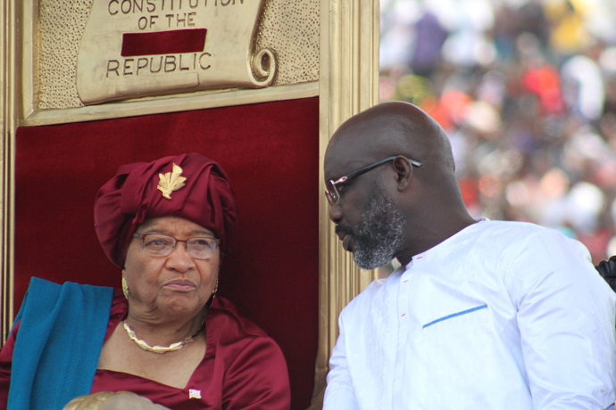 George Manneh Weah (right) visits with former president Ellen Johnson Sirleaf during Weah’s inauguration as Liberia’s president at Samuel Doe stadium in Monrovia. Both leaders are United Methodist. Photo by E Julu Swen, UMNS.
